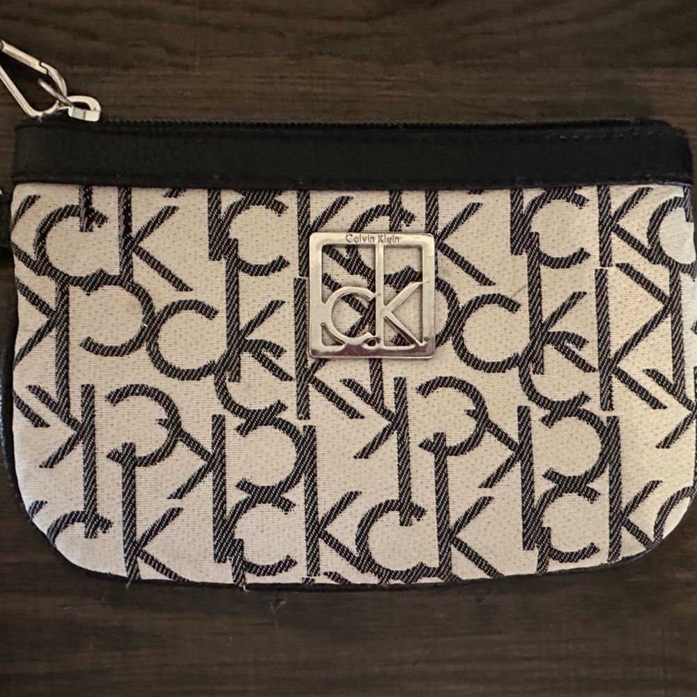 Calvin Klein Wristlet cream and black colored